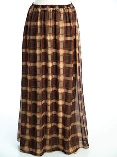 This gorgeous plaid maxi skirt flows beautifully to the floor. It's also a perfect day-to-night style. This skirt is made of chiffon and features an elastic waist, a finished hemline, and full length. Basic Maxi Dress, Plaid Maxi Skirt, Modest Wardrobe, Modest Maxi Dress, Modest Maxi, Chiffon Maxi Skirt, Fashion Night, Chiffon Maxi, Brown Plaid