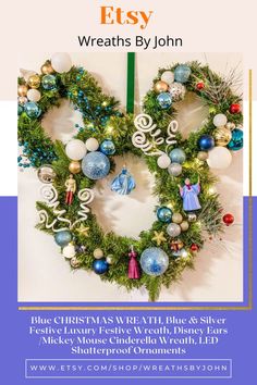 a christmas wreath hanging on the wall with ornaments around it and decorations in different colors