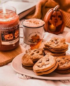 cookies on a plate next to a jar of pumpkin butter