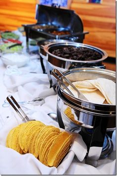 the buffet table is full of food and drinks