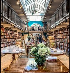 a library filled with lots of books and flowers