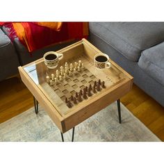 a coffee table with chess set on it