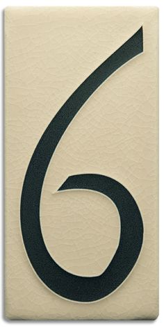 the number six is shown in black on white paper with an arrow pointing up to it