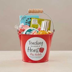 a red bucket filled with lots of different items