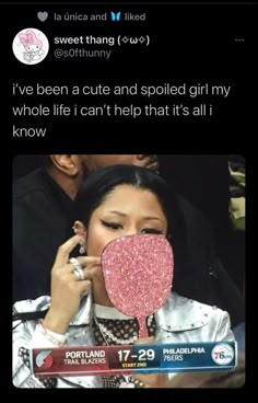 a woman holding a heart shaped lollipop in front of her face with the caption i've been cut and spoiled girl my whole life can't help that it's all i know