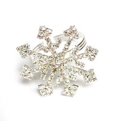 a snowflake brooch is shown on a white background