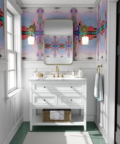 a bathroom with two sinks and a large mirror above the sink is decorated with colorful wallpaper