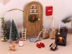 a miniature christmas scene with a mailbox and decorations