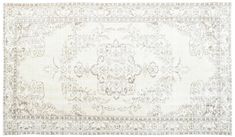 an antique rug with white and beige colors