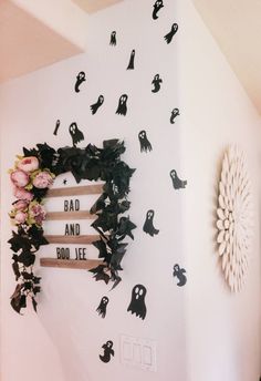 the wall is decorated with black and white halloween decorations