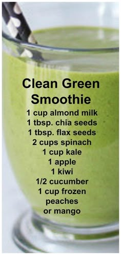 a green smoothie recipe in a glass bowl with a spoon on the side, labeled clean green smoothie