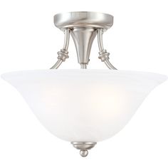 a semi flush ceiling light with white glass shades