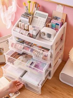 a desk with drawers and various items on it