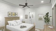 a bedroom with white walls and ceiling fan in the corner, along with a bed