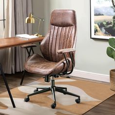 a brown leather office chair sitting on top of a rug next to a wooden desk