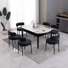 a dining table with six chairs around it