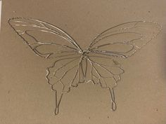 a drawing of a butterfly on a piece of paper