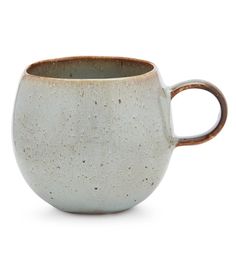 a white and brown coffee cup on a white background