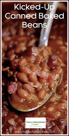 a spoon full of baked beans with the words kicked up canned baked beans