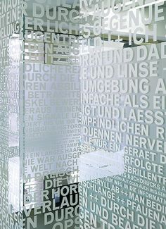 a large glass block with words all over it