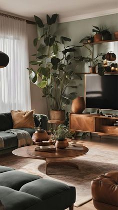 a living room filled with furniture and a flat screen tv mounted on a wall next to a window