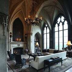 an elegant living room with high ceilings and large windows