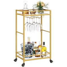 a bar cart with wine glasses and liquor bottles on it's wheels is shown