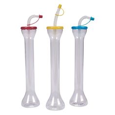 three different types of drinking straws in glass tubes with lids and handles, one is yellow, the other is blue