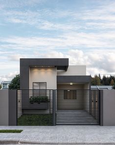 a modern house with an entry way and stairs leading up to the front door