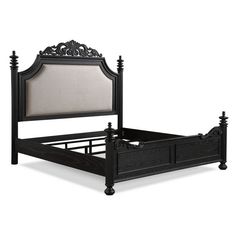 a black bed frame with an intricate headboard and foot board is shown against a white background