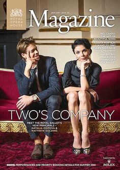 a magazine cover with two people sitting on a couch