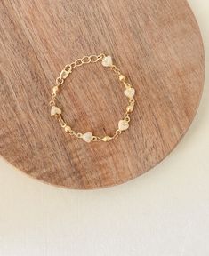 This is such a beautiful & whimsical bracelet made for all ages, 4mm shimmery enamel hearts with beautiful strong 14k gold filled  chain, this is a beautiful statement piece but is dainty enough for everyday wear. This would layer beautifully with any other gold piece and it's a perfect gift for moms, kids, babies, any celebrations this is made with 14k gold filled findings and can be worn daily, but be sure to keep away from harsh chemicals, soaps &  fragrances for long lasting wear, continued Dainty Gold Name Bracelet With Heart Charm, Dainty Adjustable Jewelry For Baptism, Adjustable Gold Plated Bracelet With Heart Charm, Gold Dainty Beaded Bracelets With Heart Charm, Dainty Gold Beaded Bracelets With Heart Charm, Dainty Rose Gold Bracelets With Heart Beads, Cute Rose Gold Bracelet Jewelry, Dainty Gold Plated Heart Bracelet, Gold Heart Beaded Bracelets For Wedding