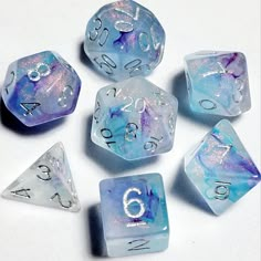 Total Party Kill Games Sea Sprite Dice Set Description 🖤🖤🖤 This gorgeous dnd dice set is a semi-translucent clear white, with marbled ribbons of aqua and purple swimming in shimmering fleck, along with silver numbering.   Perfect for new and old-school roleplaying games (RPGs) like Dungeons & Dragons (DnD), Call of Cthulhu (CoC), Blades in the Dark, Shadowrun, Dungeon World, Numenera, Dungeon Crawl Classics (DCC), Savage Worlds, Starfinder, Pathfinder (PFRPG), Rifts and many more! Our dice ma D&d Accessories, Goblin Hoard, Dungeon Crawl Classics, Cool Dnd Dice, Resin Crafting, Dice Goblin, Dnd Stories, Blades In The Dark, Savage Worlds