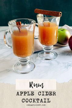 two glasses filled with apple cider cocktail