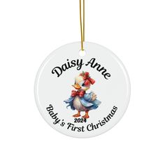 a white ornament with an image of a baby's first christmas chicken