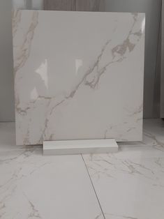 a white marble counter top in a room