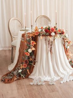 the table is decorated with flowers and candles