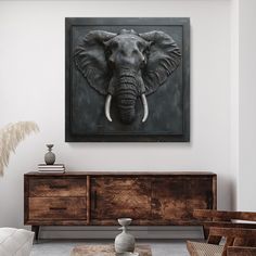 an elephant's head is shown on the wall above a table