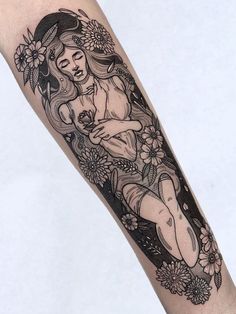 a woman with flowers on her arm is sitting in the middle of a flower frame