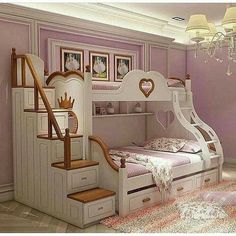 a bedroom with a bunk bed, stairs and pictures on the wall above it in pink tones