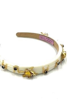 Soho Style Busy Bee Headband This exquisite headband features stunning golden bee inlays, adding a touch of whimsy and elegance to your look. Crafted from a soft yet sturdy material, the headband ensures comfort while securely holding your hair in place. The intricate bee designs, delicately detailed in shimmering gold, create a striking contrast against the band, making it a standout accessory. Perfect for both casual outings and special occasions, this headband effortlessly combines style and Bee Headband Grasshoppee, Bee Headband, Hair Care Kit, Organic Conditioner, Teasing Comb, Highlighted Bangs, Bee Designs, Soho Style, Bobby Pin Hairstyles