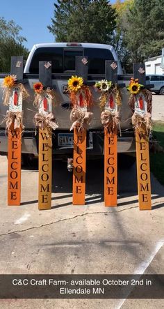 a truck parked in a parking lot decorated with sunflowers and welcome home signs