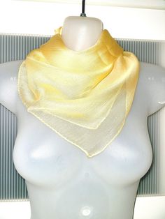 This is a very feminine silk scarf with a metallic thread, so the scarf actually has a glossy shiny look because of that. The scarf is in mint condition and will make a beautiful gift. The color of the scarf is yellowish orange. It can be used as a neck wrap, headband, hair tie, bag decor, etc. It is a lovely fashion accessory to match your dress, shirt and jacket. The scarf is absolutely lovely. It comes in a gift wrap and with a 'Thank you' card. For more scarves in my store visit: https://www Gold Silk Scarf For Spring, Silk Scarf For Spring Party, Silk Scarf For Party In Spring, Elegant Yellow Silk Scarf, Elegant Gold Scarves For Spring, Elegant Silk Scarf With Satin Finish For Summer, Elegant Satin Finish Silk Scarf For Summer, Elegant Solid Silk Scarf For Summer, Elegant Solid Color Silk Scarf For Summer