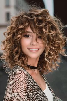 Cute Medium Curly Haircuts, Curly Shag Hairstyles Medium, Mid Length Layered Curly Hair, Layered Chunky Curls With Bangs, Natural Curly Hair Color Ideas Balayage, Balayage Types, Caroline Flack Hair, Shoulder Length Curly Hair With Layers, Medium Permed Hairstyles