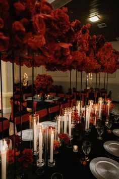 a long table is set with candles and flowers for an elegant dinner or banquet event