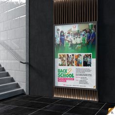 an advertisement for back to school is displayed on the side of a wall next to some stairs