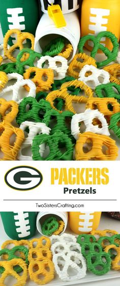 green bay packers pretzels are stacked on top of each other in front of football helmets