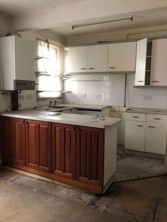 an empty kitchen is shown in the middle of being remodeled with new cabinets and appliances