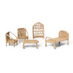 wicker furniture is arranged on a white background