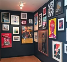 a room filled with posters and pictures on the wall